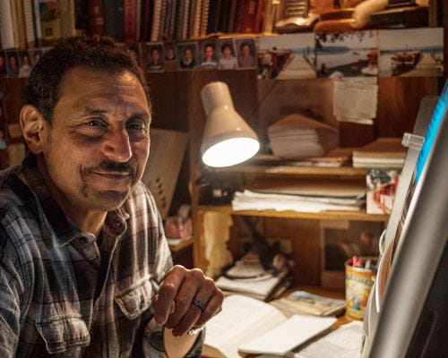 PJ Piccirillo at desk writing